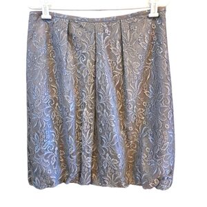 LOFT skirt with shimmery metallic silver fabric.  Zips on the side. Size 10.